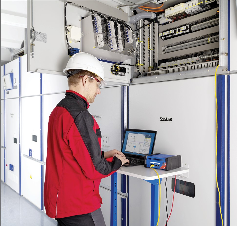 an engnear in a substation testing relays